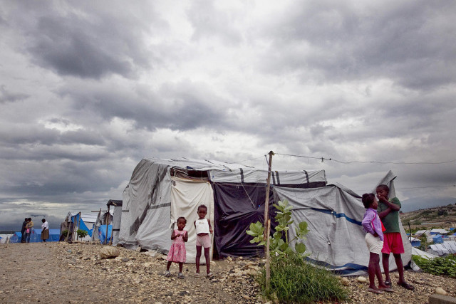Dark clouds loom over a camp for people displaced by the January 2010 earthquake, in Port-au-Prince, Haiti. Tropical storm Tomas swept over the country, finally dissipating on 5 November, but left behind far less damage than predicted.