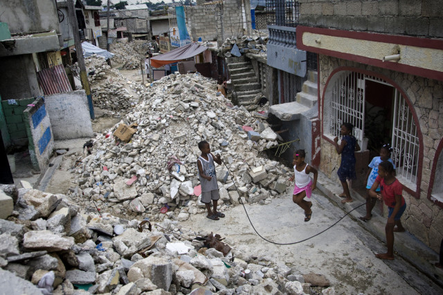 Children jump rope in a rubble-strewn street in the Delmas 32 neighbourhood of Port-au-Prince, Haiti. The UN Stabilization Mission in Haiti (MINUSTAH) is continuing to work with national and international agencies to clear Port-au-Prince of the piles of debris left over from the earthquake that struck the city on 12 January, 2010.