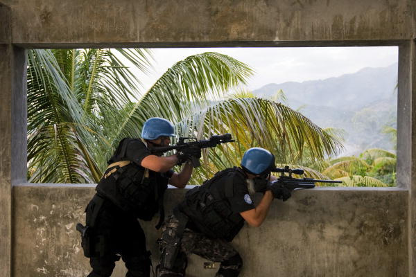 Members of the Jordanian Special Weapons and Tactics (SWAT) team of the United Nations Stabilization Mission in Haiti (MINUSTAH) take position during a drug seizure exercise. 22/Dec/2008. UN Photo/Marco Dormino. http://www.unmultimedia.org/photo/