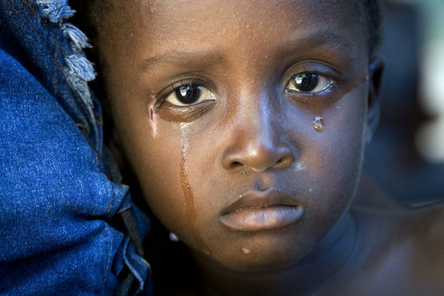 A cholera-infected child cries after receiving medical treatment in L'Estere, Haiti. An outbreak of the disease began in October 2010 and is lasting several months.